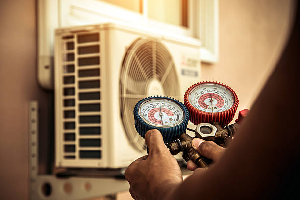 Professional Air Conditioning Service technician working in New Bloomfield, MO